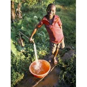  Boy at Water Tap, Chuka Village, Mount Kenya, Kenya, East 