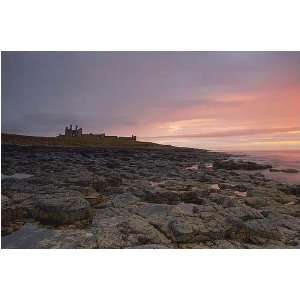 Dunstanburgh Castle At Dawn by Andrew Fyfe. size 32 inches width by 