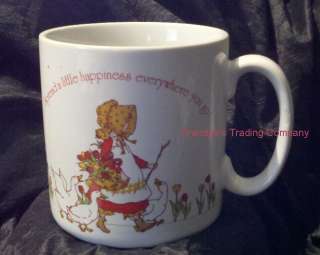 offer a festive and adorable ceramic mug featuring holly hobbie 