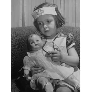  Mott playing Nurse with doll as parents adjust children to abnormal 