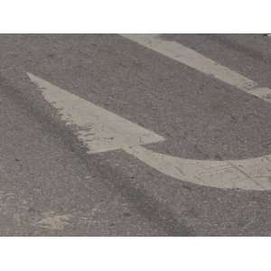  U Turn Arrow Painted onto a Faded Blacktop Road Stretched 