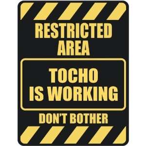   RESTRICTED AREA TOCHO IS WORKING  PARKING SIGN