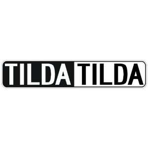   NEGATIVE TILDA  STREET SIGN