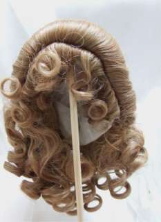 Auction is for 1 synthetic doll wig size 13/14.