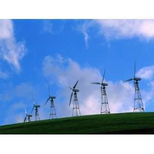  Wind Generators Twirling Against the Backdrop of Blue Sky 