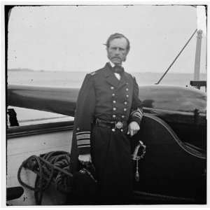   Dahlgren standing by a Dahlgren gun on deck  Home
