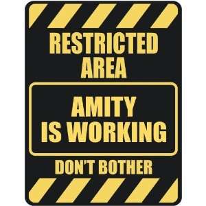   RESTRICTED AREA AMITY IS WORKING  PARKING SIGN