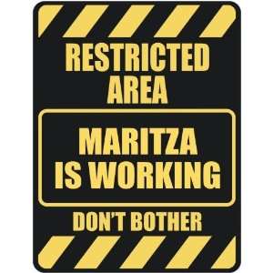   RESTRICTED AREA MARITZA IS WORKING  PARKING SIGN