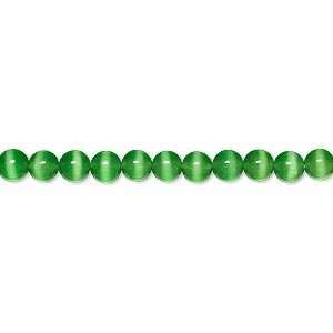 1917 6mm round Bead, cats eye glass, green, A grade. Sold per 15 