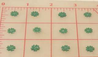 12 Vintage little green plastic flatback flowers 9mm  