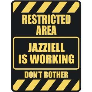   RESTRICTED AREA JAZZIELL IS WORKING  PARKING SIGN