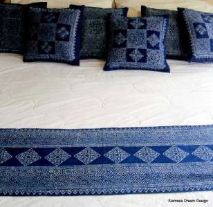   ladies preparing the indigo dye and drawing the batik patterns in wax