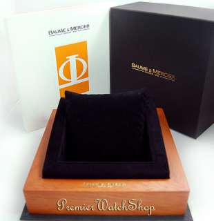 watch comes with baume mercier box case and instruction booklet